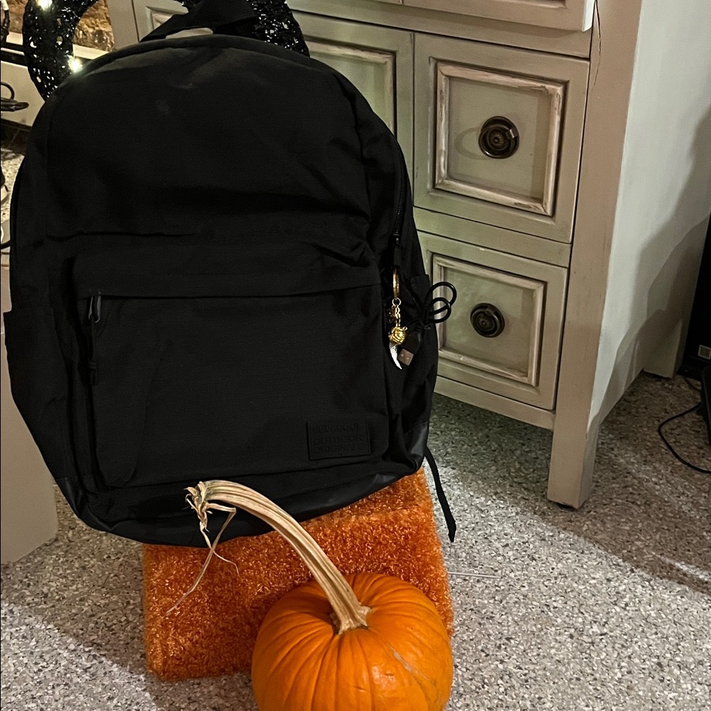 Black backpack with Gold Accents and no label